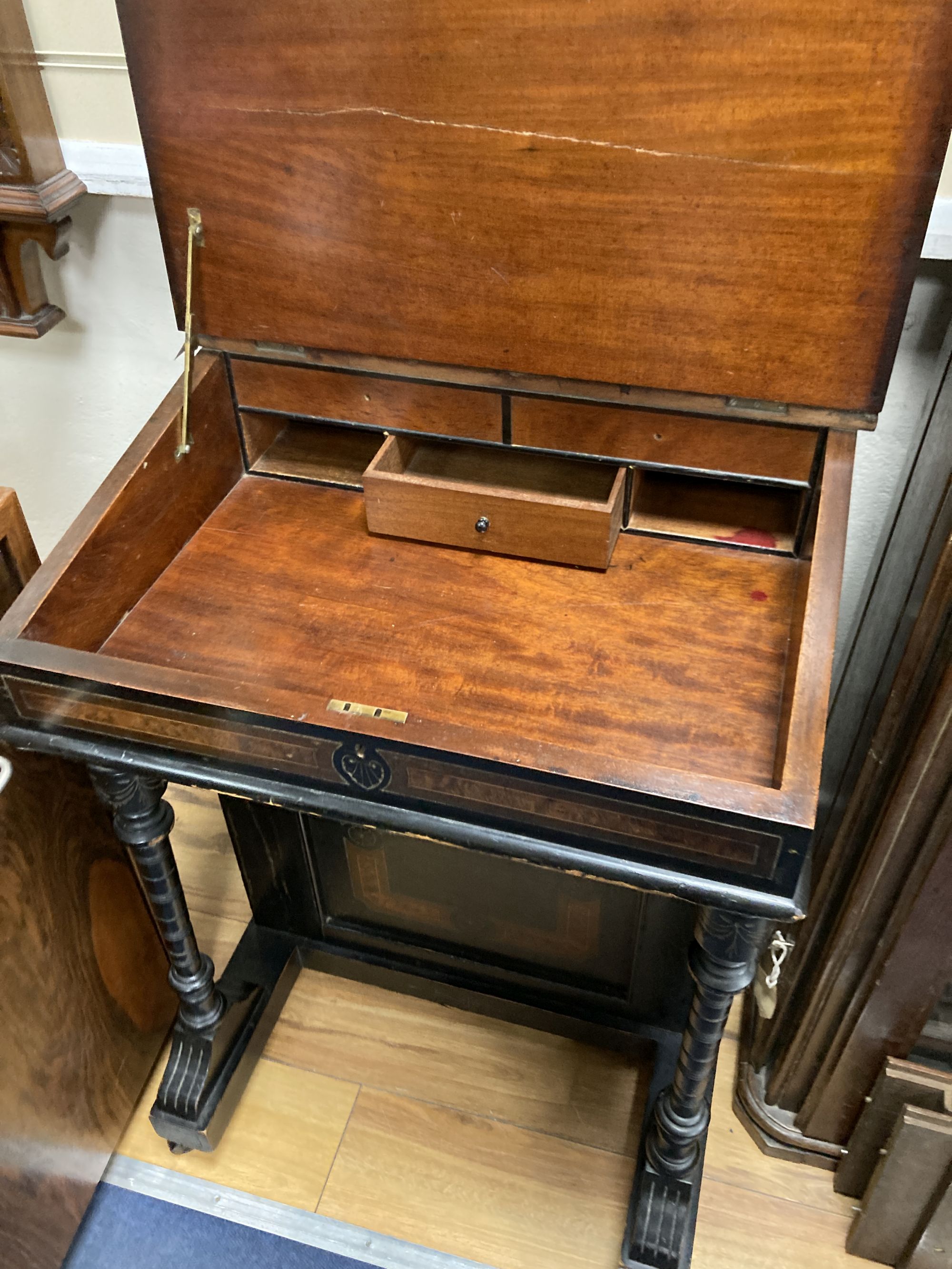 A late Victorian ebonised and amboyna Davenport, width 55cm, depth 56cm, height 86cm